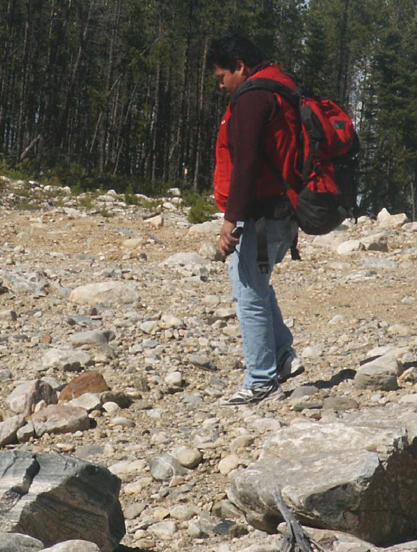 Alfred Gilpin, Cree prospector, surveying rocky terrain